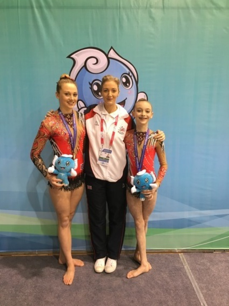 Main image for Gymnasts claim gold in China