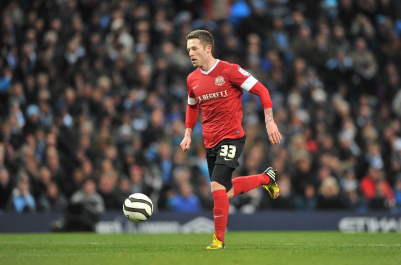 Main image for Reds defender turned financial adviser kept busy during crisis 