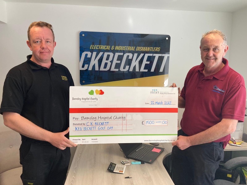 Main image for Firm hands cheque to hospice