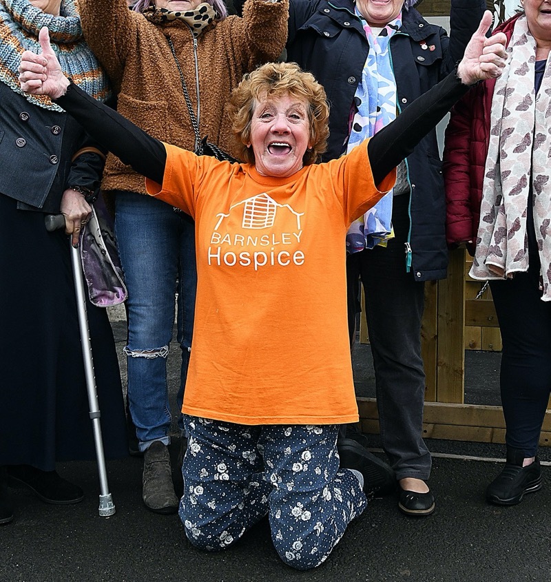 HOORAY! - The ‘Grabby Grannies’ based at the ‘Heaven and Ale’ pub in Agnes Road celebrate their success in raising £1042 for Barnsley Hospice - group leader Judy Holling (front centre) thanks all, young and old, for their contibutions.  Picture: Wes Hobson.  PD090800.