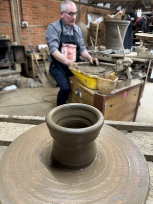 Canon Keith Farrow with one of the commemorative Cawthorne pots.