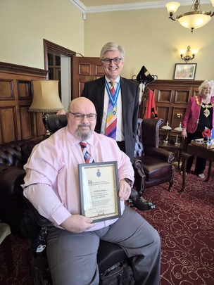 AWARD: Andrew with John Baddeley.