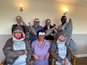 FACING YOUR FEARS: Staff at Deangate Care Home are set to swim with sharks. Pictured are (back, from left) Rachael Dawson, home manager, Lisa Naylor, senior carer, Cheryl Pinner, cook, Troy Hunte, carer, with (front, from left) resident Margaret Cooper, Rachael Addy, activities coordinator, and resident Joan Giggal.