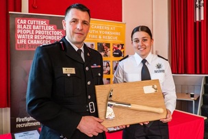 AWARD: Deputy chief fire officer Andy Strelczenie with Emily.