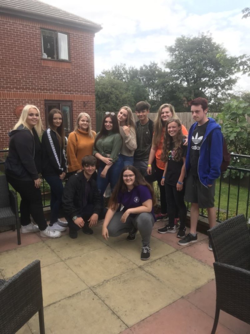 Main image for Teenage students are a hit at care home as they help Doreen celebrate her birthday