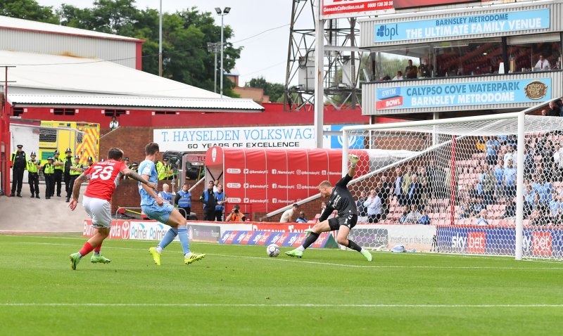 Main image for Collins saves last-gasp penalty as fans return with victory