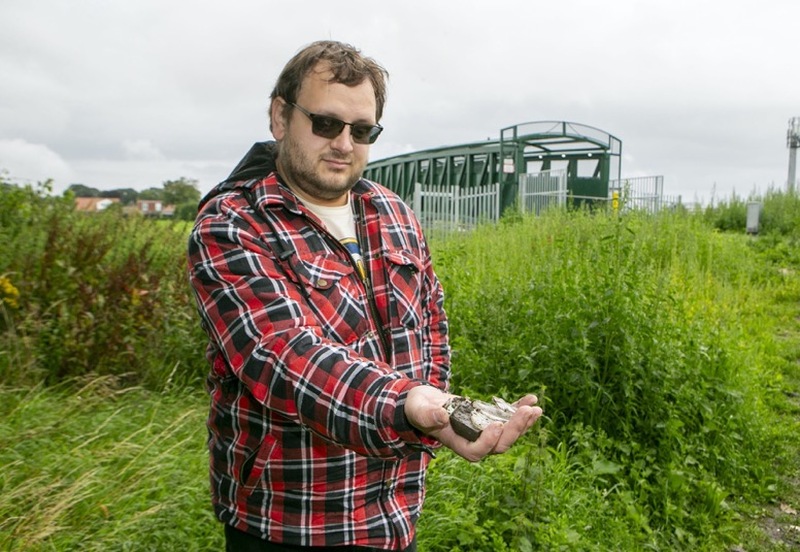 Glass Pie Park: Coun Chris Wray with glass from the old tip, near the new bridge at penny pie park. picture Shaun Colborn PD092406