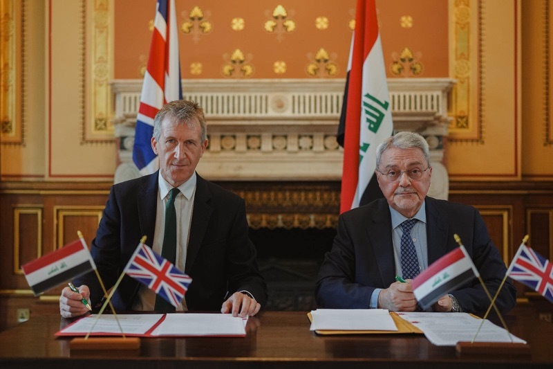 SIGNING: Dan Jarvis with Iraq’s Deputy Foreign Minister.