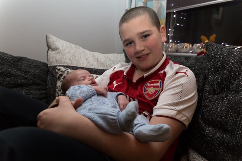 Main image for Ethan braves the shave for baby Hugo