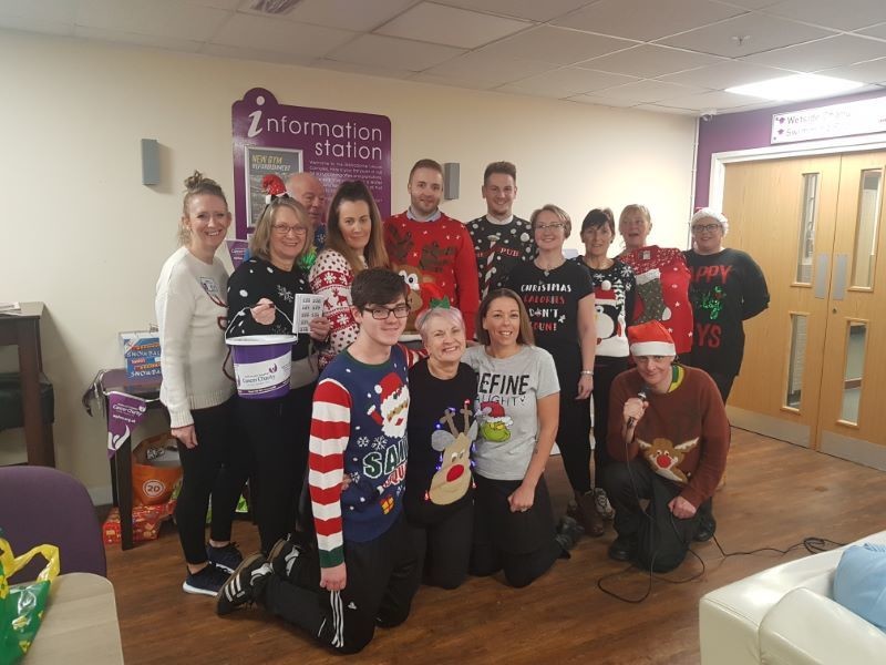 Main image for Staff jump at chance to raise charity cash