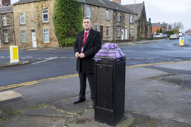Cut Down camera: Coun Kevin Osborne at the base of the chopped down camera column in Darfield. Picture Shaun Colborn PD092768
