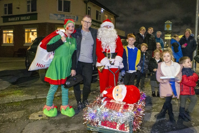 Julie Popplewell alias Santa with helper Natasha Downing outside the Barley Sheaf in Wombwell. Picture Shaun Colborn PD092773