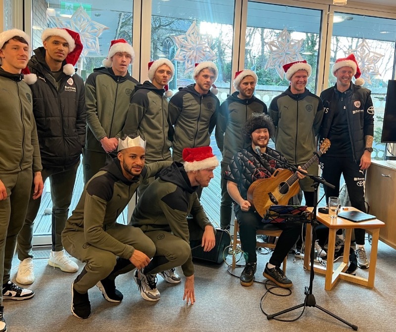 FESTIVE FUN: Tom Masters with some of the Barnsley squad.