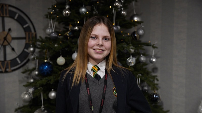 SELFLESS: Young Harmony Cutting handed out presents at the weekend.