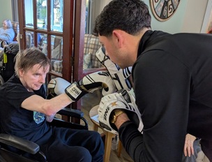 Chris Shaw, a resident at Deangate Care Home, enjoying a boxing session.