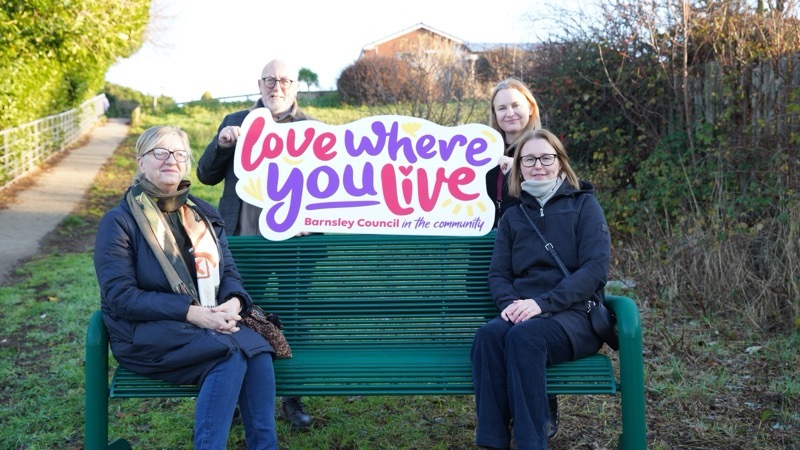 TAKE A SEAT: Councillors gather on the newly-placed bench in Monk Bretton Photo: Scott Firth.