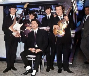 TRIBUTE: Alan, seated, with the band The Dolphins.