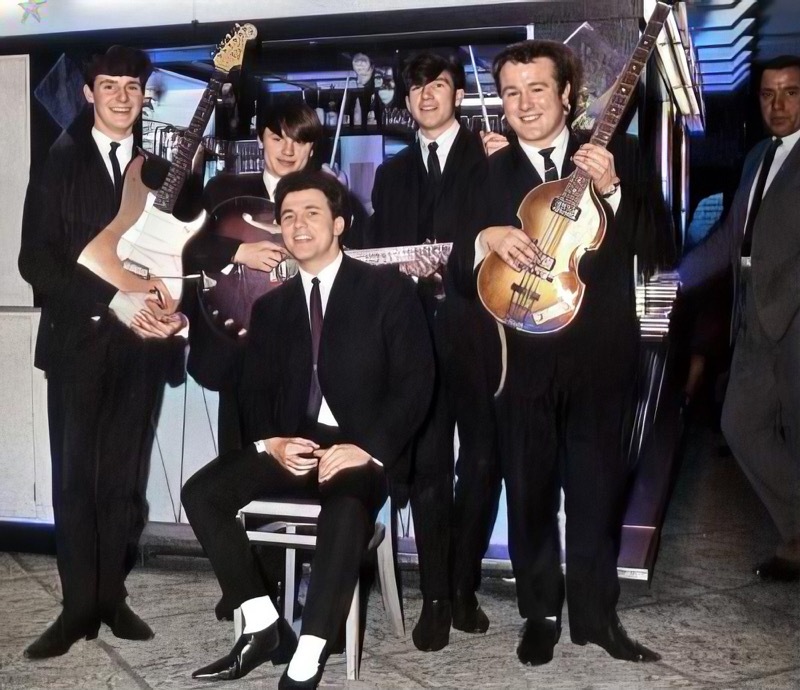 TRIBUTE: Alan, seated, with the band The Dolphins.