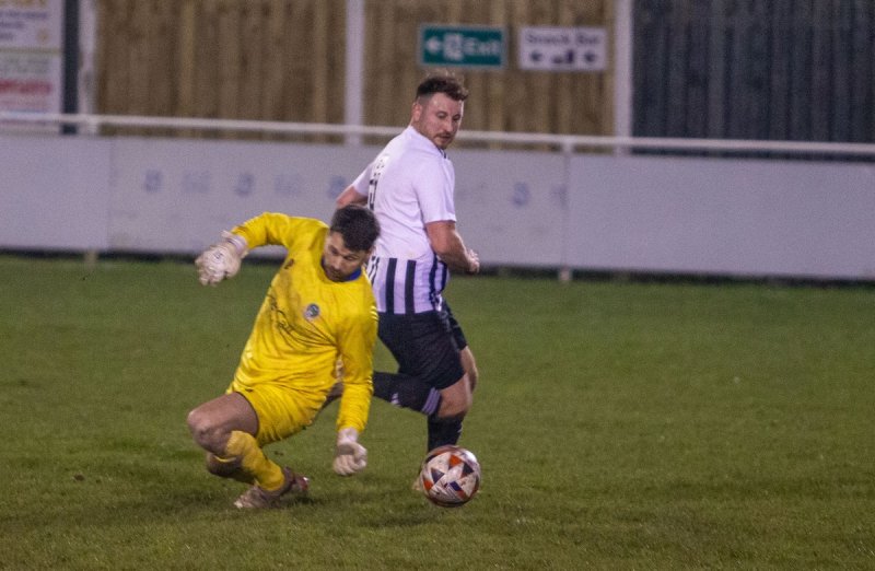 Nathan Perks rounds  the Retford goalkeeper to score