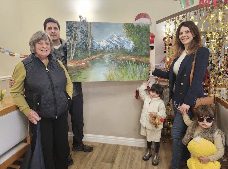 The artwork is handed over to the care home.
