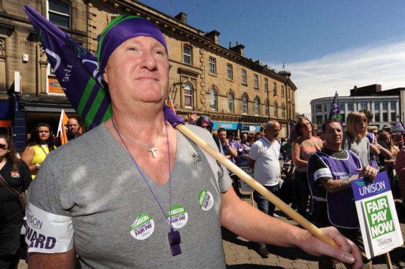 Main image for Hundreds strike over pay dispute