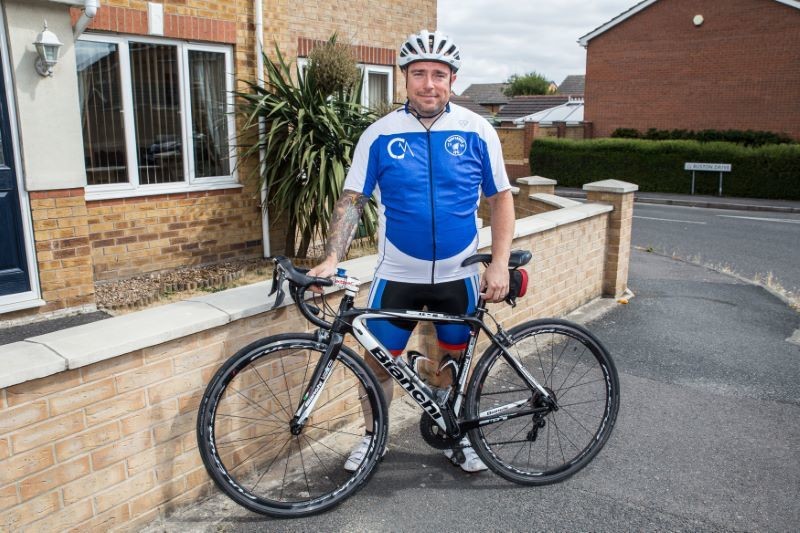 Main image for Christopher is getting on his bike for Redfearns