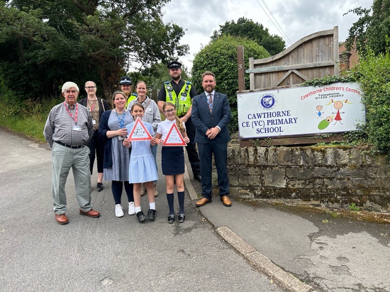 TRAFFIC CALMING CALL: Leaders behind the slow-down scheme pictured outside Cawthorne Primary School on Tuesday.