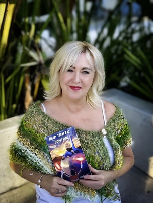 Main image for Hairdresser Lizzi pens book after move to Oz