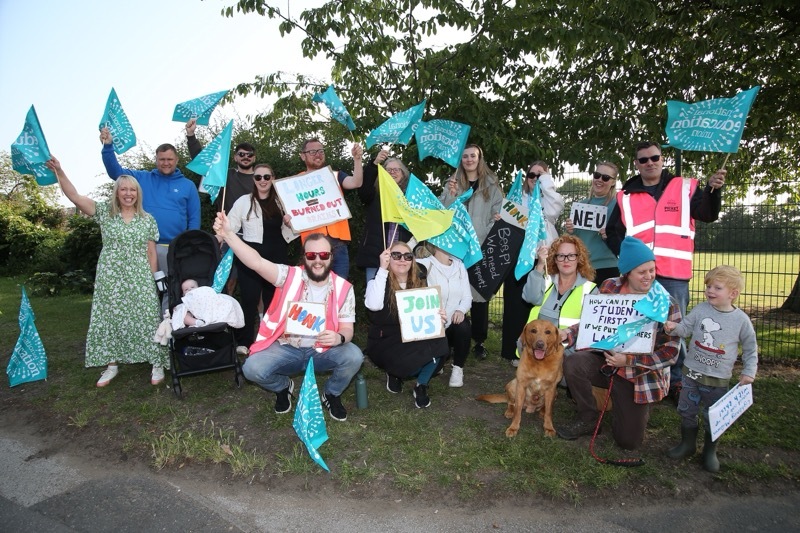 Staff protest during a previous day of action.