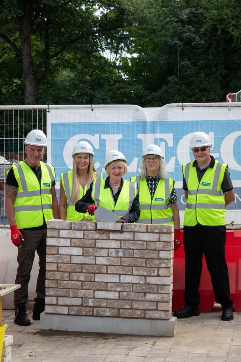 SUPPORT: Trustees of the Ian Pratt Foundation laying the first bricks down.