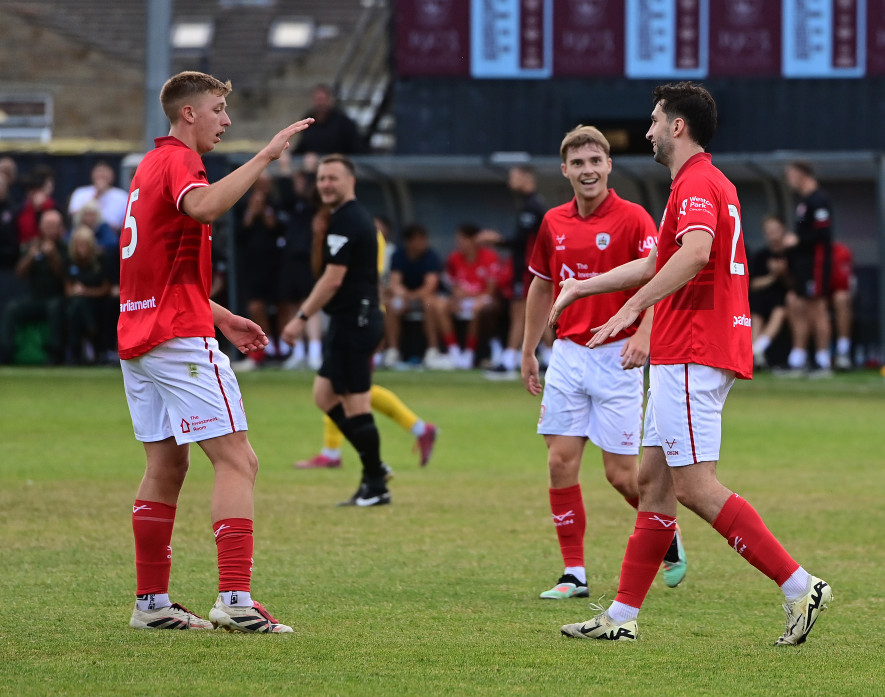 Neil Farrugia, right, celebrates his goal with Tom Senior and Luca Connell