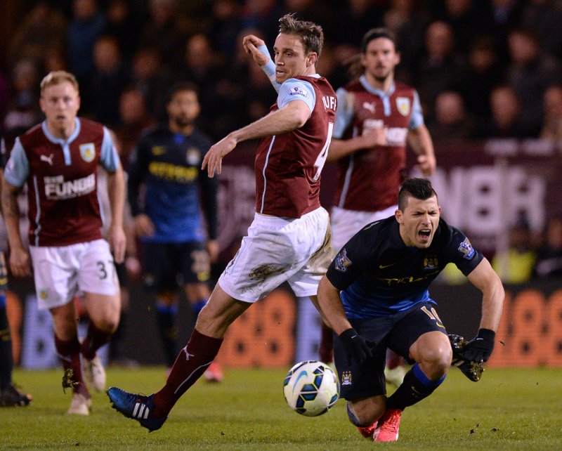 Michael Duff tackles Sergio Aguero. Picture: Getty.