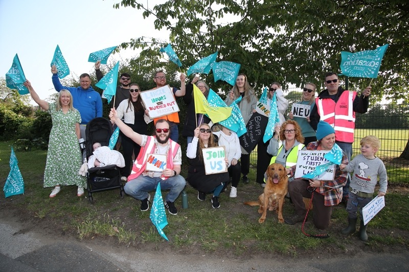 TAKING ACTION: Staff during earlier strike action.