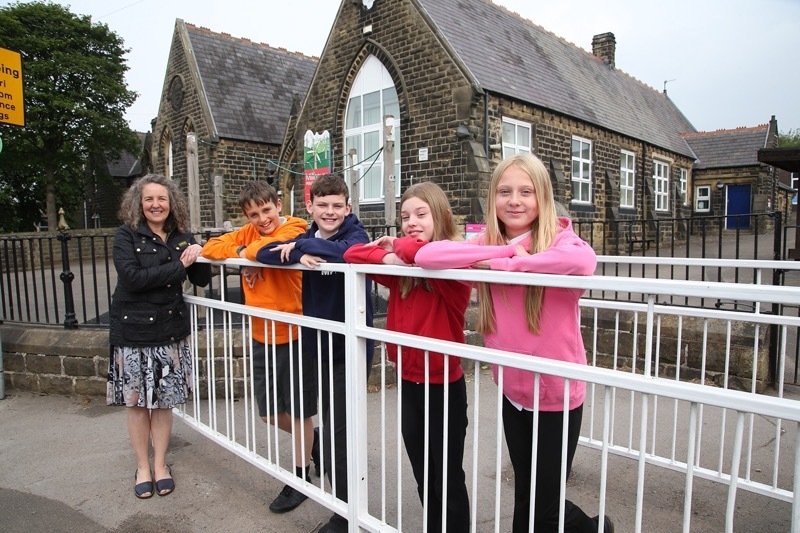 REDUCTION: The speed limit has finally been reduced outside Millhouse Primary following years of campaigning to the delight of year six pupils, teacher and councillors. Picture: Shaun Colborn. PD094191