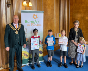 IN BLOOM: The competition winners at the town hall.