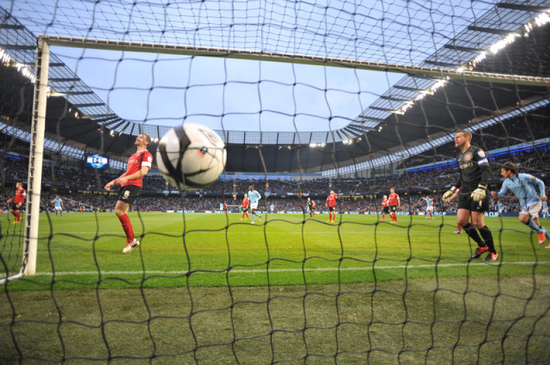 Main image for Tevez treble as City put five past Reds