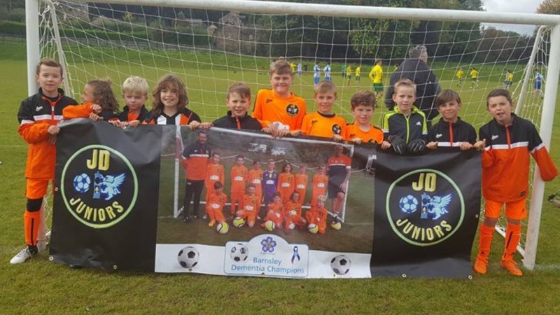 Main image for JD Juniors show they are a community club with efforts for charity