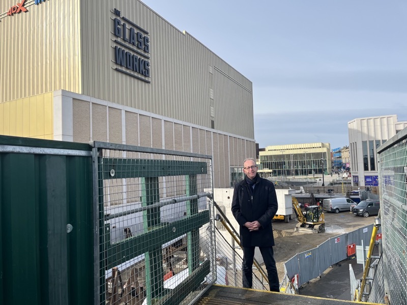 TAKING SHAPE: Council leader Sir Steve Houghton, pictured on the temporary footbridge, said the new bridge will become a prominent addition to the town centre.