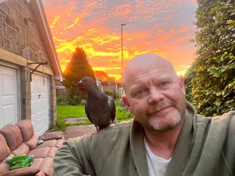 Paul Guy and his pigeon Woodly.