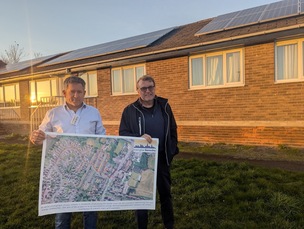 Energise Barnsley’s Andy Heal with Coun Andy Waters outside houses with newly-installed solar panels on Pollyfox Way.