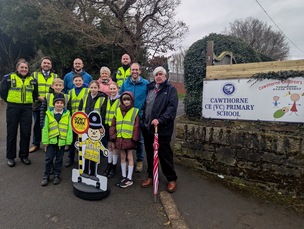 School council pupils with councillors and community support officers.