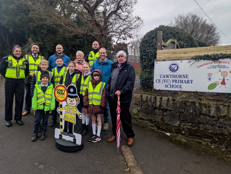 School council pupils with councillors and community support officers.