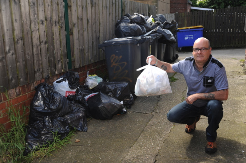 Main image for Street plagued with flies after bins go unemptied