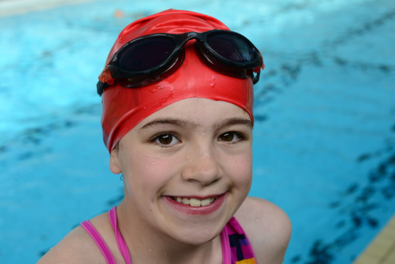 Main image for Olivia takes on swimming challenge