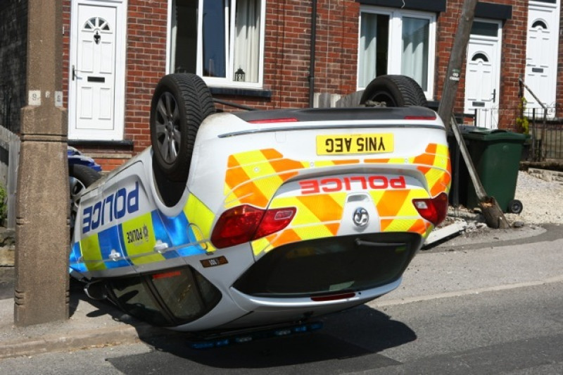 Main image for Runaway police car ended up on roof