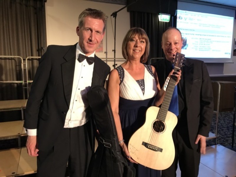 Main image for Couple win Ed Sheeran guitar auction