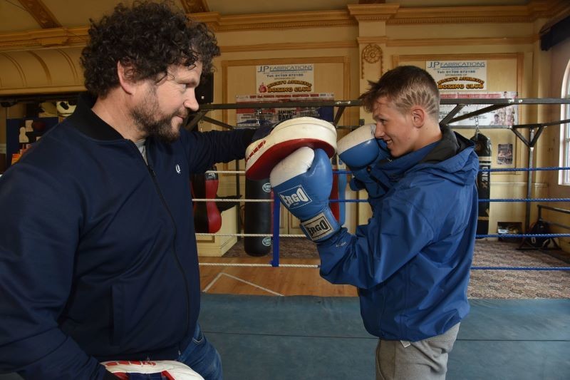 Main image for Champion Josh helps charity pack a punch