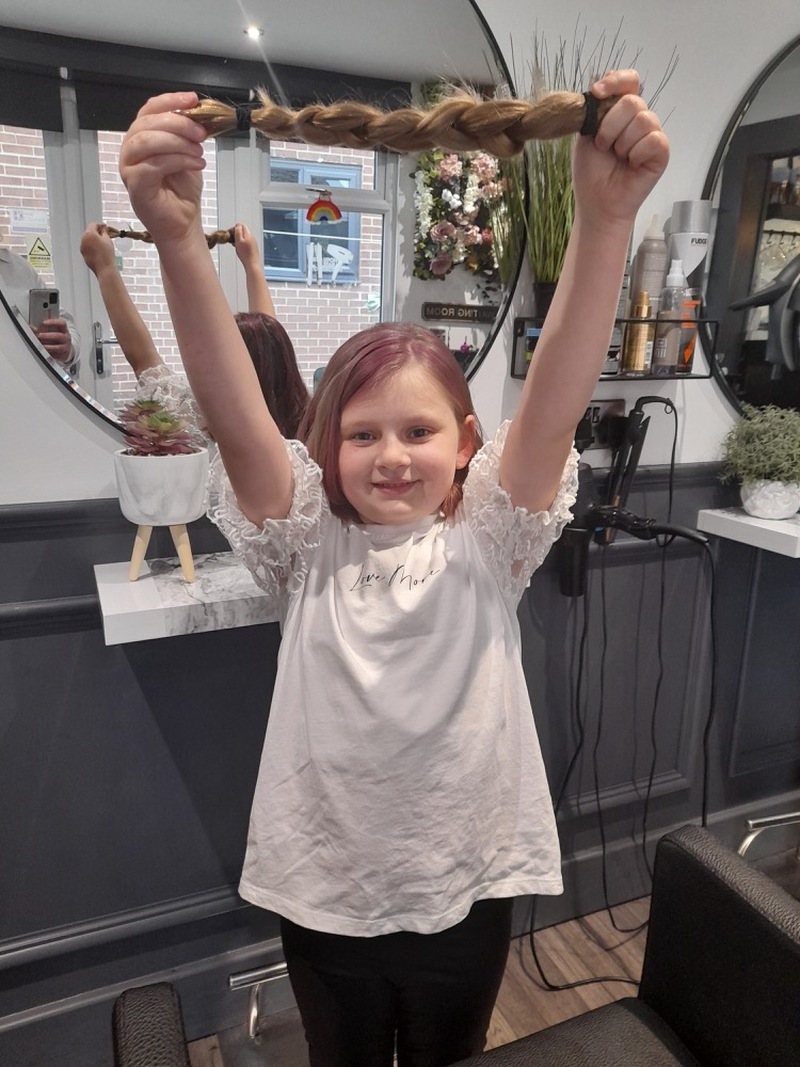 Main image for Hetty’s long locks chopped off for kids’ cancer charity