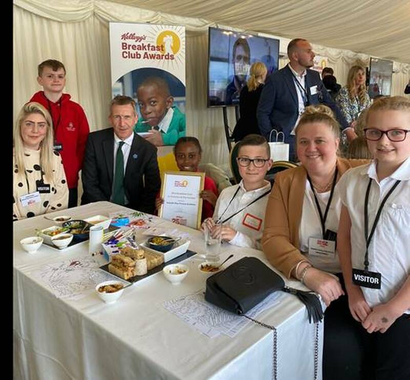 NUMBER ONE: Dan Jarvis with representatives from the school.