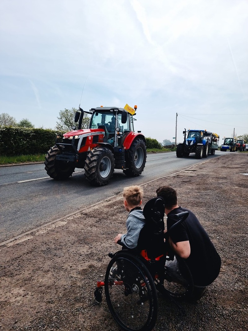 TRACTOR RUN: Louie watching on before he got his chance to take part as a special guest.